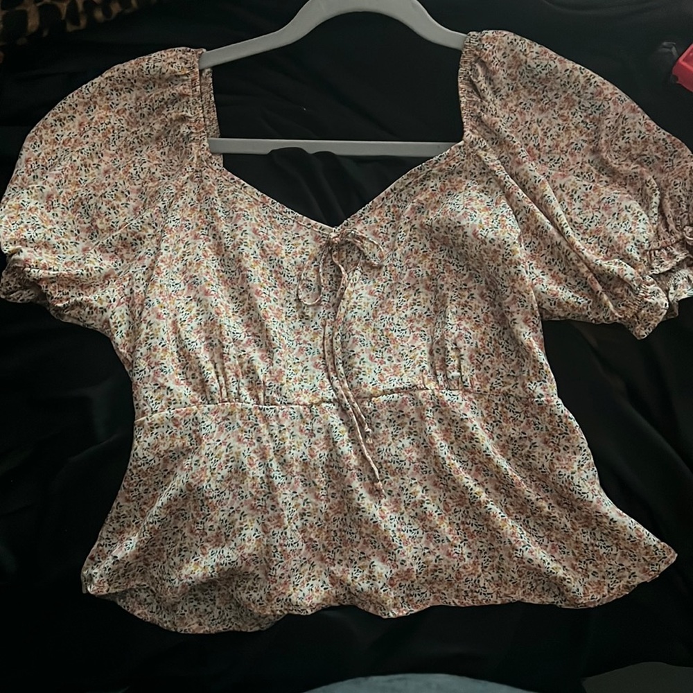 Size large. Partial open back cute blouse